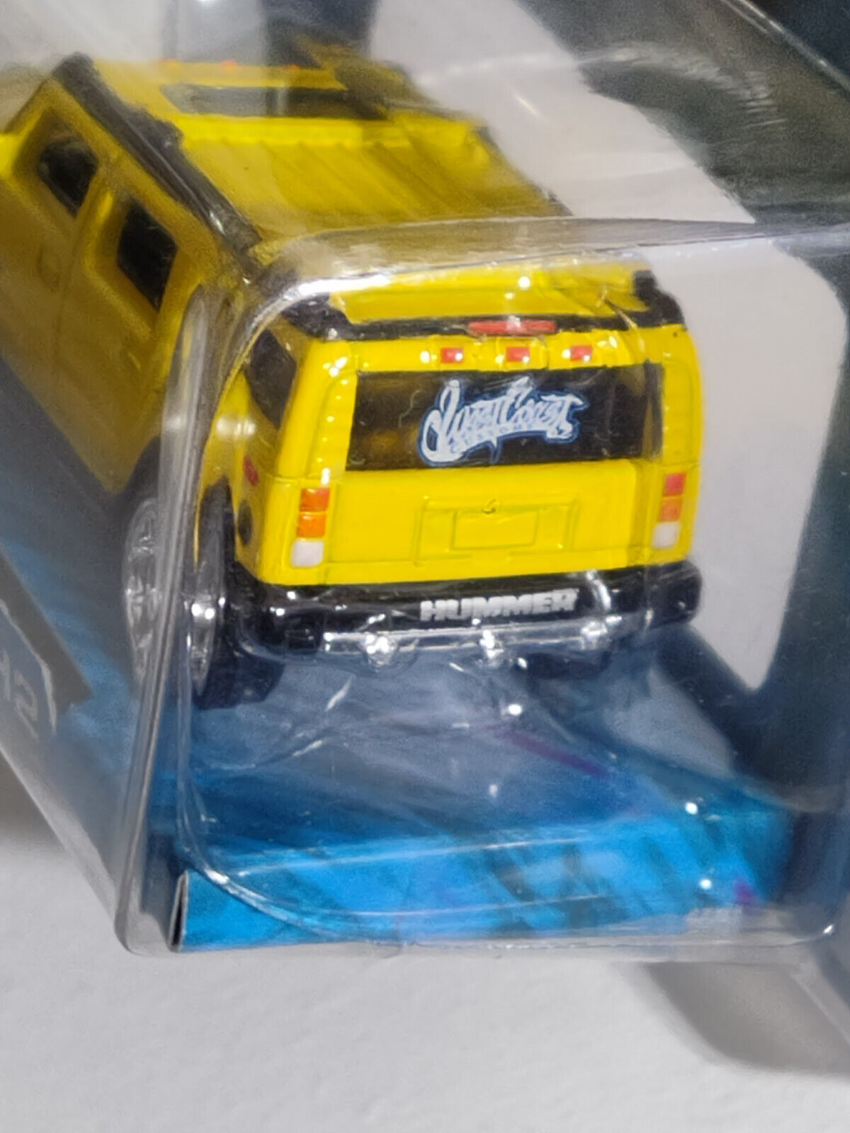 Hot Wheels WHIPS West Coast Customs Hummer H2 Yellow PACKAGE HAS SCRAPES ALL OVE