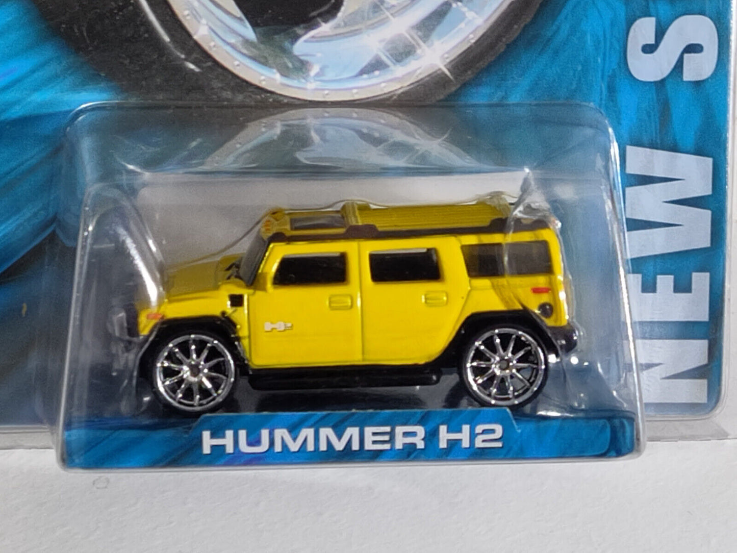 Hot Wheels WHIPS West Coast Customs Hummer H2 Yellow PACKAGE HAS SCRAPES ALL OVE