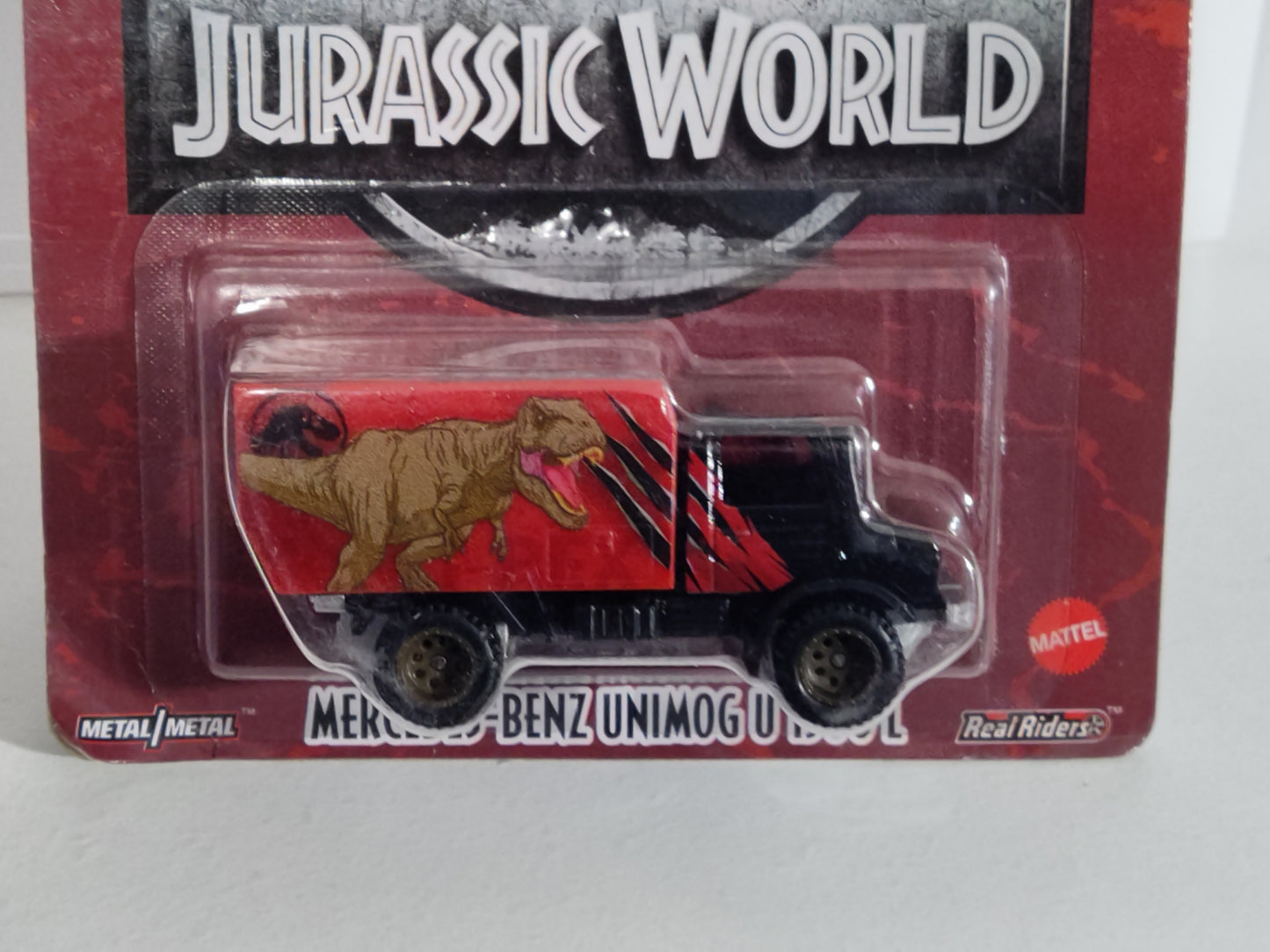 Hot Wheels HCN97 Jurassic World Series #2  Mercedes Benz Unimog U 1300L CORNERS BADLY CREASED (Box 78)